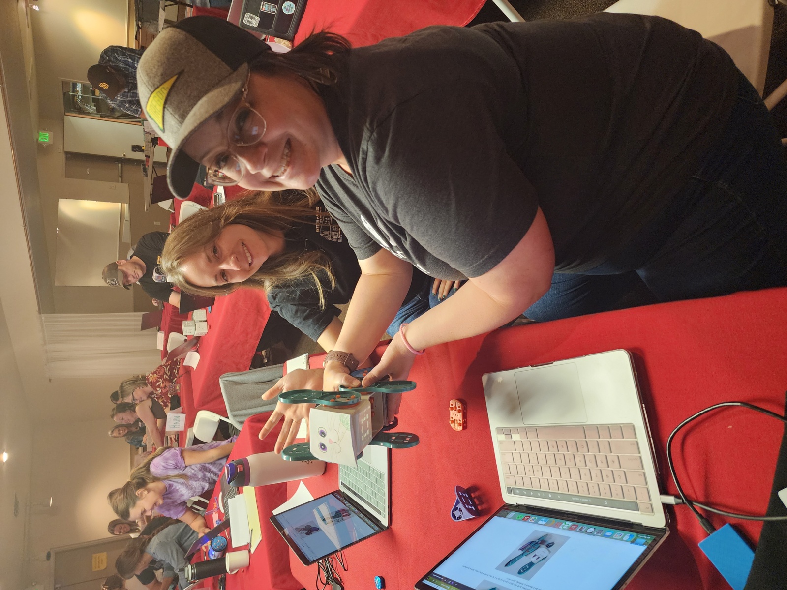 Junction City teachers Carly Miller and Sarah Sharp work on their robotics project