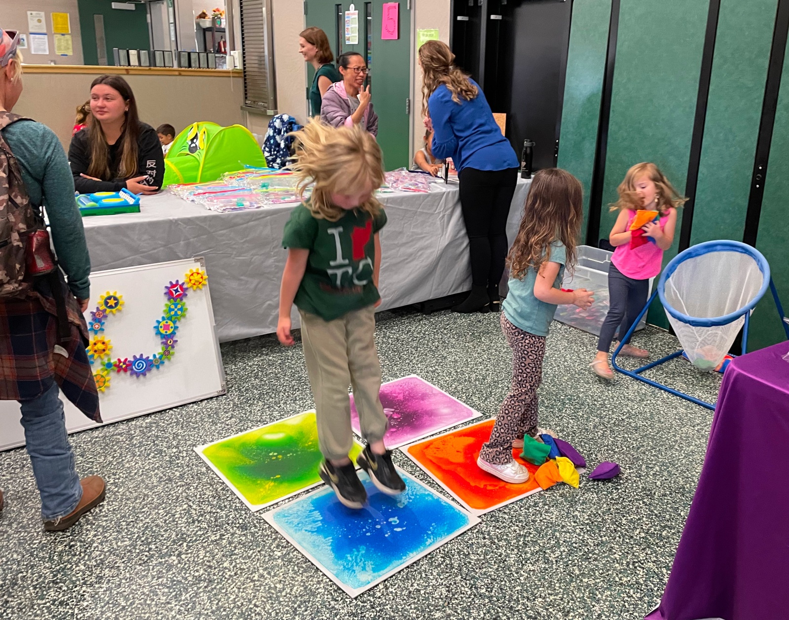 Kids playing on a little indoor obstacle course sponsored by Mountain Kids Therapy